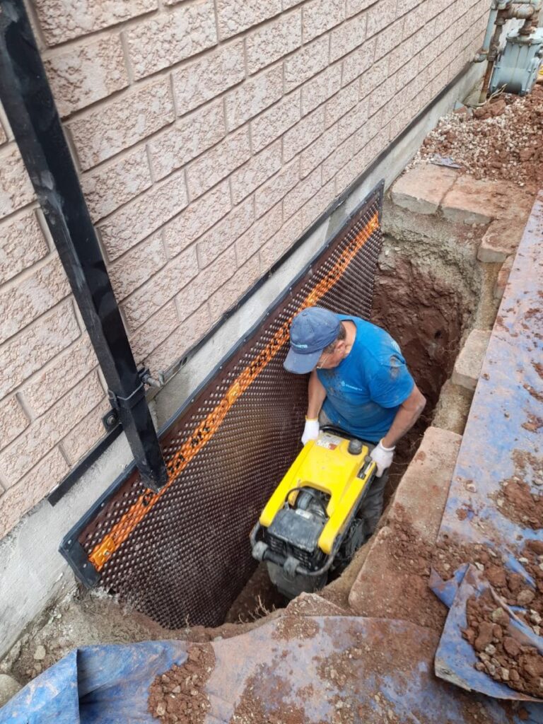 exterior basement waterproofing drainage in progress