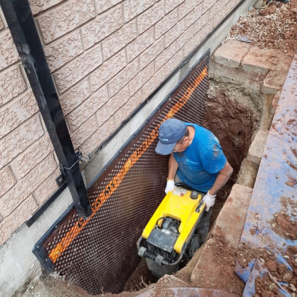 exterior basement waterproofing drainage in progress